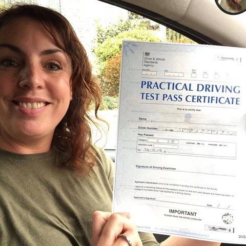 woman with driving certificate in her hands