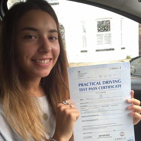 woman with driving certificate in her hands